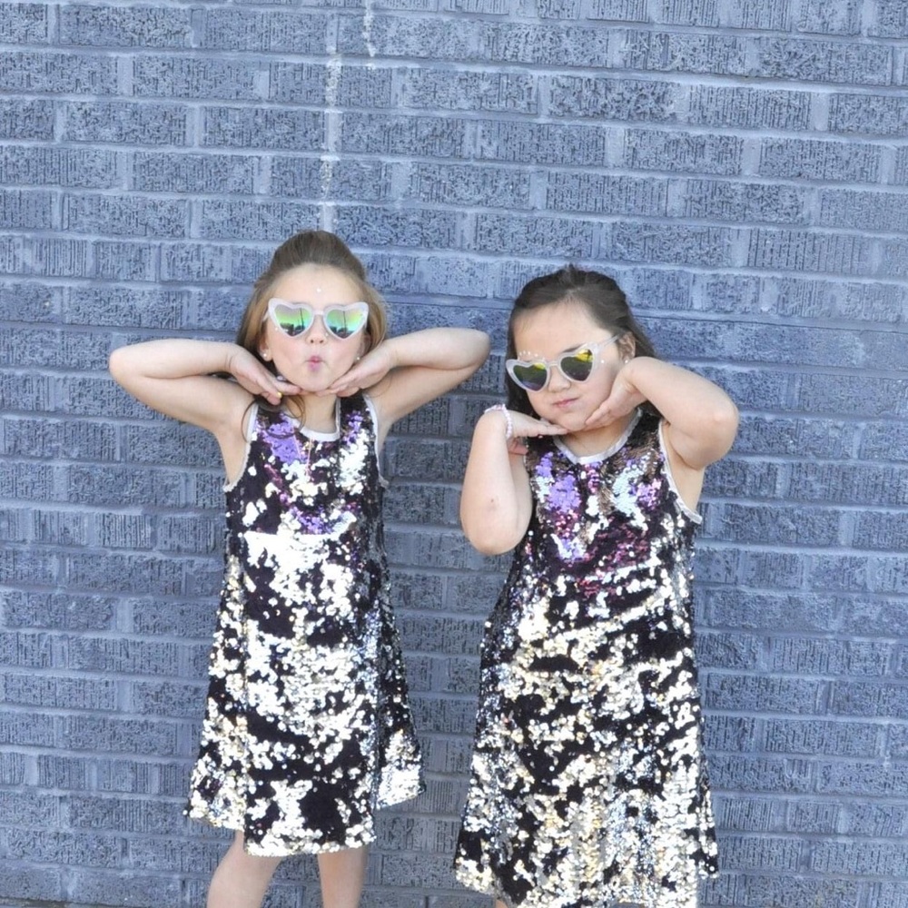 Girls size 7/8 purple and silver flip dress.